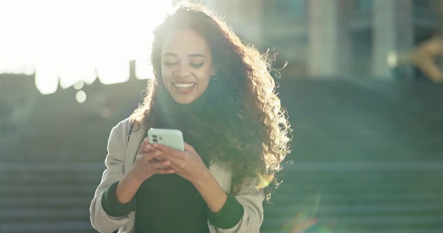 Outdoor, smile and woman with a smartphone, typing and contact with connection, lens flare or network. Person, city or happy girl with a cellphone, digital app or email notification with social media | Shutterstock HD Video #1108982939