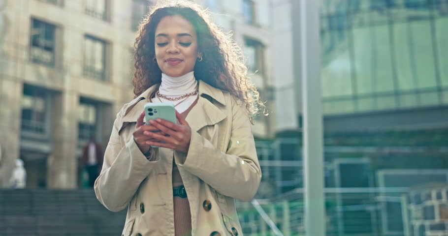 Outdoor, walking and woman with a smartphone, typing and internet with connection, email notification and digital app. Happy person, city and girl with a cellphone, contact and website information | Shutterstock HD Video #1108982987