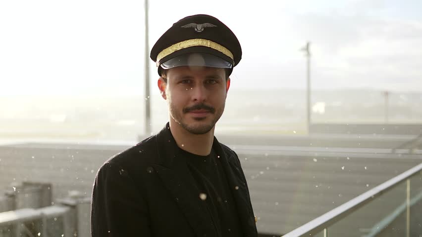 Portrait of Proffesional Male Pilot Captain Working in Aviation Business