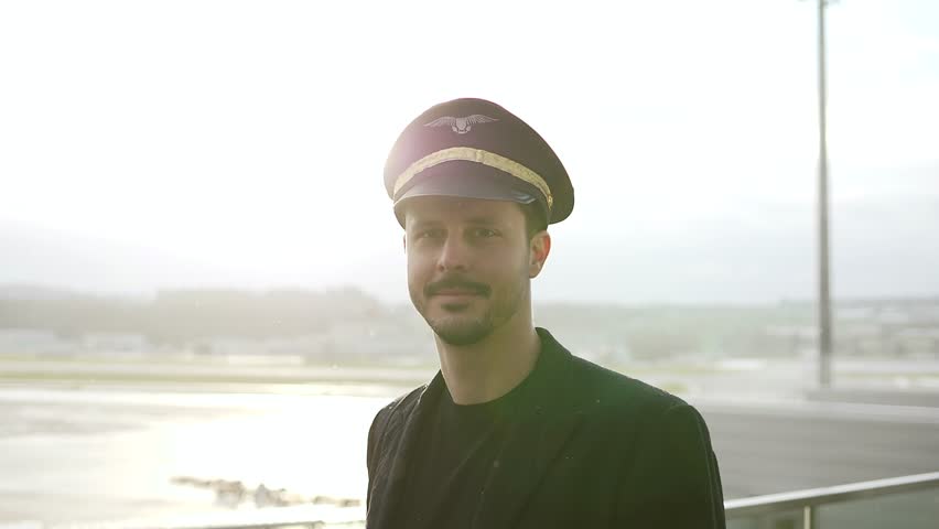 Portrait of Proffesional Male Pilot Captain Working in Aviation Business