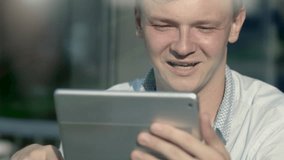 Young Man Having A Video Call on Mobile Tablet Screen Talking