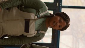 Vertical video Warehouse employees using smartphone placed on tripod to make video for social media promoting the company. Coworkers filming themselves in storage room showcasing their daily tasks - Powered by Shutterstock - Get 15% off with code: PIKWIZARD15