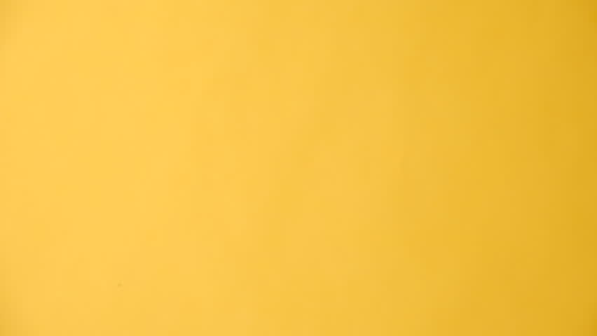 Vertical footage of female hand finger pointing up demonstrating blank area on yellow empty space commercial background loop. Recommending sign. With place for text or image. Special offer concept | Shutterstock HD Video #1108990655