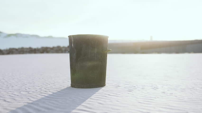 Gray metal garbage bin or trash can on the beach | Shutterstock HD Video #1108991247