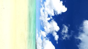 Beautiful view of tropical blue sea or ocean by the white beach in summer, Okinawa in Japan, Nobody, Landscape or travel, Vertical video for smartphone footage