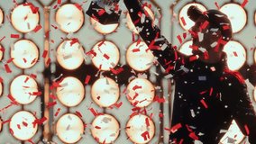 SLOW MOTION Portrait of racing driver pilot celebrates a win in a championship, standing on a podium rising a trophy above his head, confetti exploding around - Powered by Shutterstock - Get 15% off with code: PIKWIZARD15