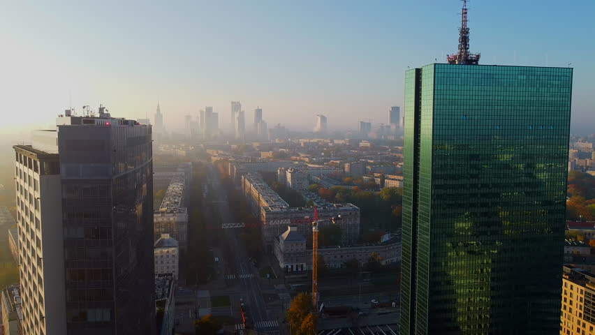 Smog or fog with toxic gases over modern city, Warsaw, Poland during a cold morning in early winter