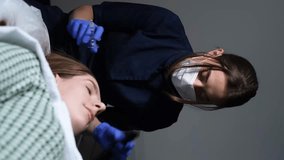 Treatment of hair in cosmetology by mesotherapy. A shot in the head. Vertical video.