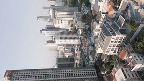 Vertical video. Aerial view of skyscrapers in downtown Bangkok, Thailand.