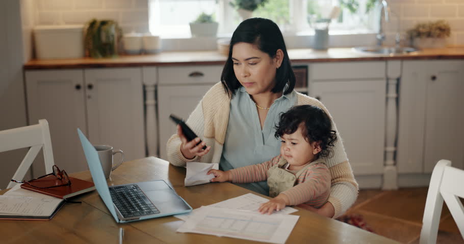 Mother, baby and phone call at laptop in home with stress or remote employee for deadline, multitask. Mom, child and frustrated or tired in work life balance, talking or communication for support Royalty-Free Stock Footage #1109019943