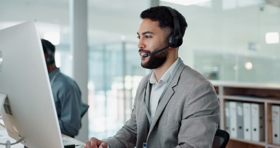 Call center, customer service and man on an online consultation on a computer working in the office. Contact us, crm and young male telemarketing consultant or agent talking for support in workplace.