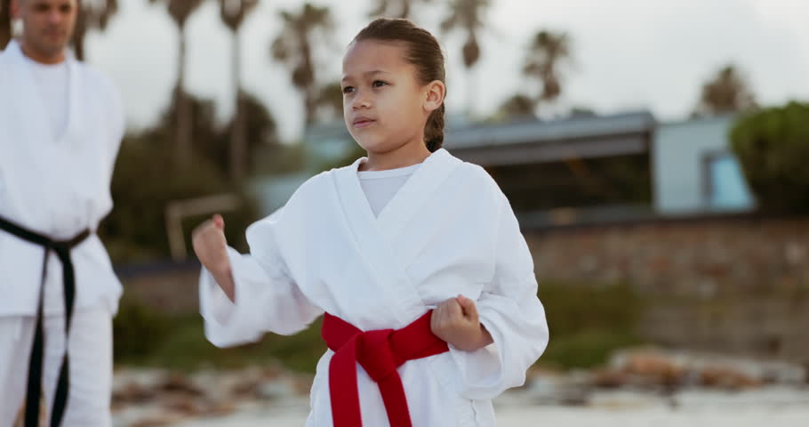 Karate, training and girl child with trainer man outdoor for self defense, learning or fighting. Martial arts, fitness and kid with instructor in nature for Taekwondo practice or protection lesson