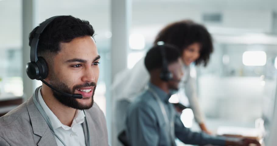 Happy businessman, call center and customer service in telemarketing, communication or support at office. Friendly man, consultant or agent smile in online advice, help or contact us with headset Royalty-Free Stock Footage #1109020127