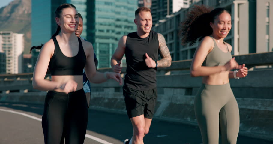 Group, race or people in city running on road for exercise, training or outdoor workout together. Sports fitness, runners or healthy friends on street for endurance, performance or cardio challenge