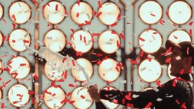 SLOW MOTION Portrait of racing driver pilot celebrates a winh in a championship, standing on a podium wit a bottle of champagne, confetti exploding around - Powered by Shutterstock - Get 15% off with code: PIKWIZARD15