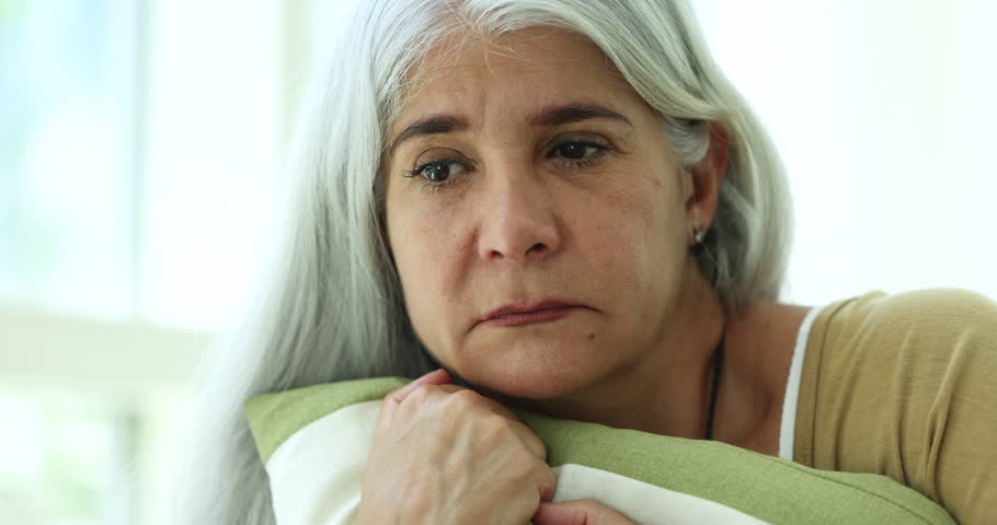 Close up portrait unhappy melancholic mature woman spend time alone at home, looks anxious, feeling lonely, lost in sad thoughts, suffers from life troubles, goes through divorce, grieving or missing Royalty-Free Stock Footage #1109028147