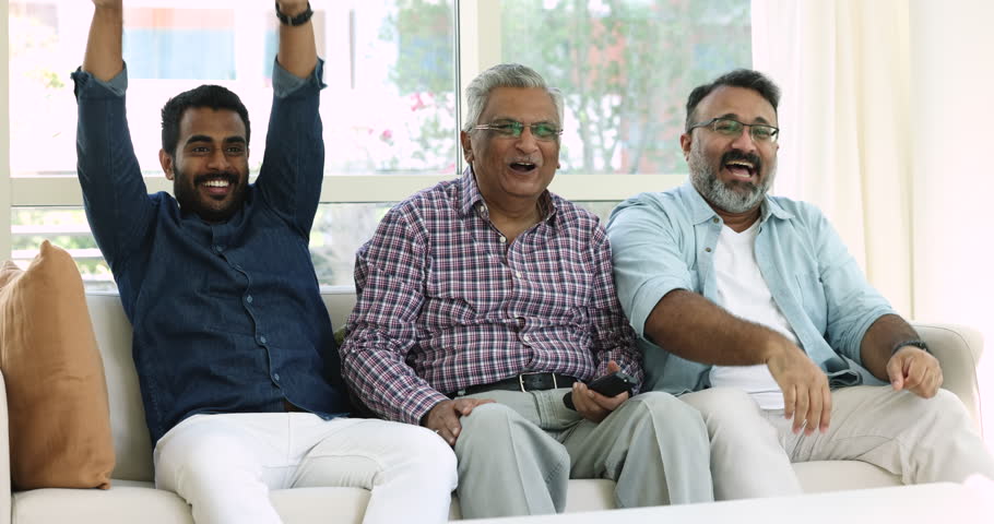 Three-generational men sit on sofa screaming with joy relish football favourite club win, celebrate goal feel overjoyed on weekend at home. Family pastime with favourite game hobby, on-line digital TV | Shutterstock HD Video #1109028207