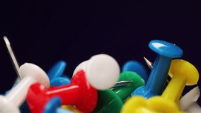 Close-up of Multi Colored push pins. Office and school stationery concept