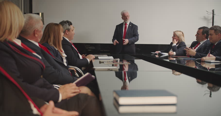 Large group of senior managers having a meeting at the meeting room office, senior managers developing a strategy, CEO giving standing speech Royalty-Free Stock Footage #1109033005