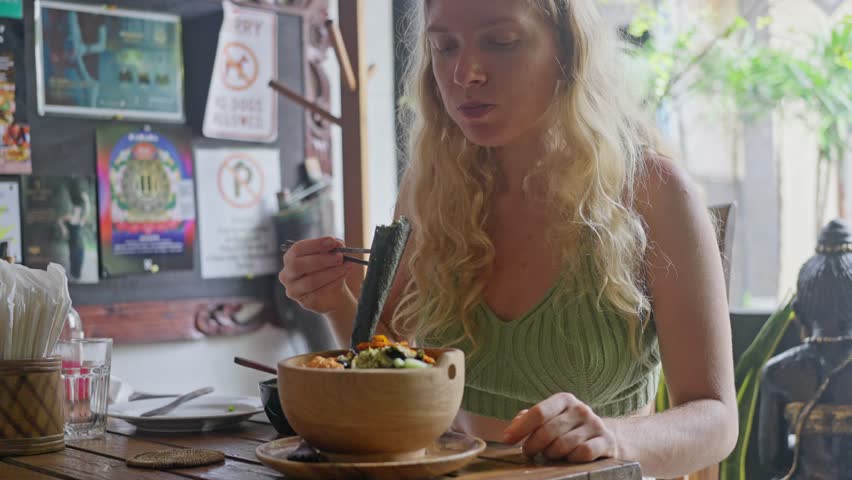 Woman eating with chopsticks Organic eating, Vegetables diet lunch. Healthy food Royalty-Free Stock Footage #1109033751