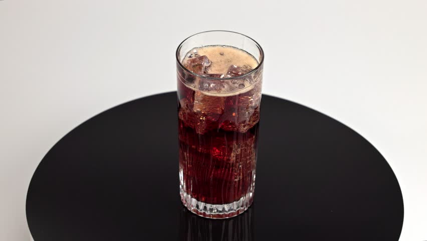 Close-up view of carbonated drink with ice cubes on rotating disk. Slow motion. | Shutterstock HD Video #1109036213
