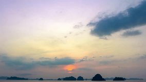 aerial hyper lapse view the moving clouds obscured the setting sun. 
the sun moving down to the islands at Tubkaek beach Krabi. 
Nature High quality footage in nature and travel concept.