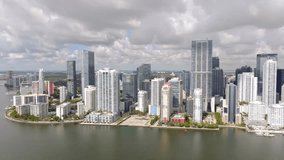 Aerial flyover and tilt down establishing stock video Brickell Miami 2023