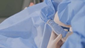Experienced surgeons perform a complex procedure for varicose veins. Vertical video