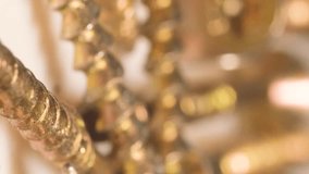 Macro video of falling metal bolts in slow motion. Many metal self-tapping screws for wood. Vertical - Powered by Shutterstock - Get 15% off with code: PIKWIZARD15