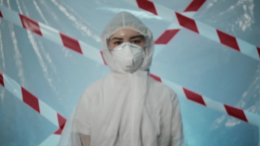 Stop disease. Infection protection. Virologist doctor. Woman medical healthcare specialist in ppe suit warning hand blue gloves gesture isolated on blue. Forbidden entrance, quarantine exclusion zone Royalty-Free Stock Footage #1109048397
