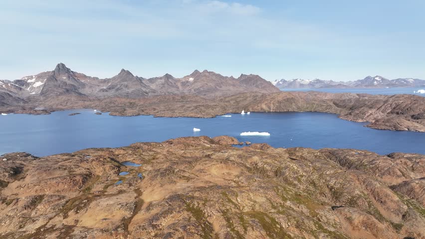 aerial view of the arctic ocean, mountains and glaciers in Greenland