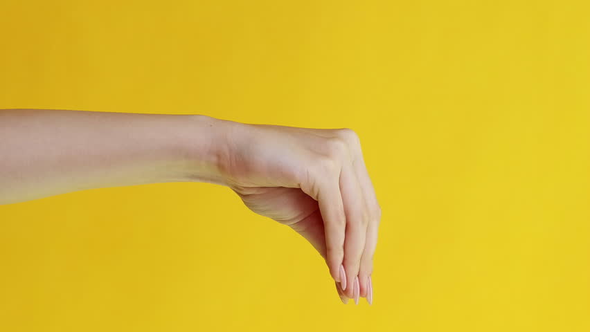 Vertical video. Hand theater. Home hygiene. News advertisement. Female woman arm mouth gesture talking to puppet in protective gloves quarreling isolated on yellow background. Royalty-Free Stock Footage #1109053971