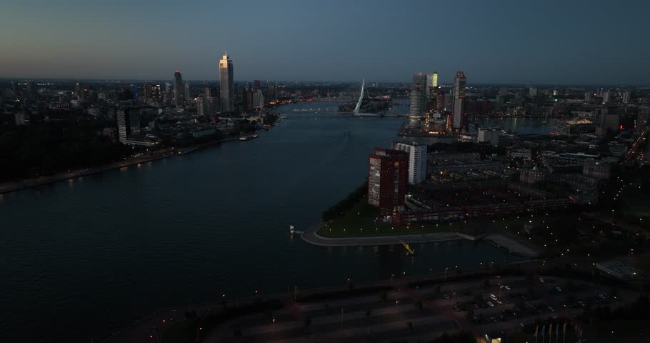 Aerial images of the Nieuwe Maas at night, the river running through the city of Rotterdam, and the port city skyline Royalty-Free Stock Footage #1109056689