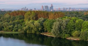 Aerial video of Manchester Skyline from Sale water park lake. 