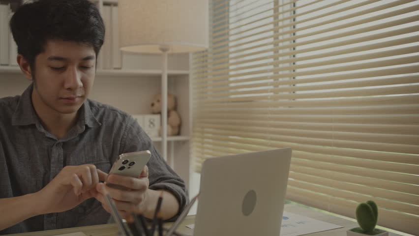 Young man typing chat or message on mobile phone with smiling face. Digital Communication, Conversation via smartphone of internet network. | Shutterstock HD Video #1109059153