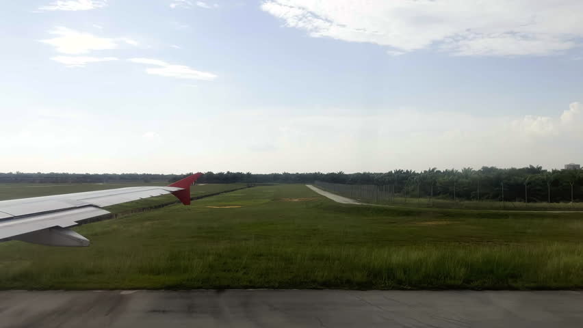 View from plane window. Plane waiting for takeoff. Kuala Lumpur, Malaysia.