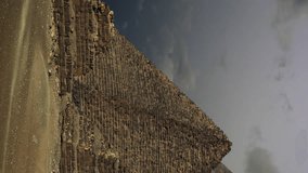 Timelapse with sunset clouds over great pyramids at Giza Cairo in Egypt . Vertical video