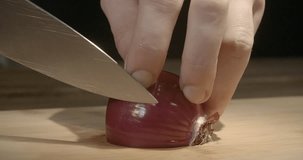 Cutting onion close up, 4k. Cooking class, recipe, cooking video, food macro. Chef is chopping onion