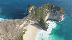Kelingking Beach, Nusa Penida, Bali, Indonesia, September 2023
Aerial drone video of the green cliffs, turquoise ocean, waves, sandy beach