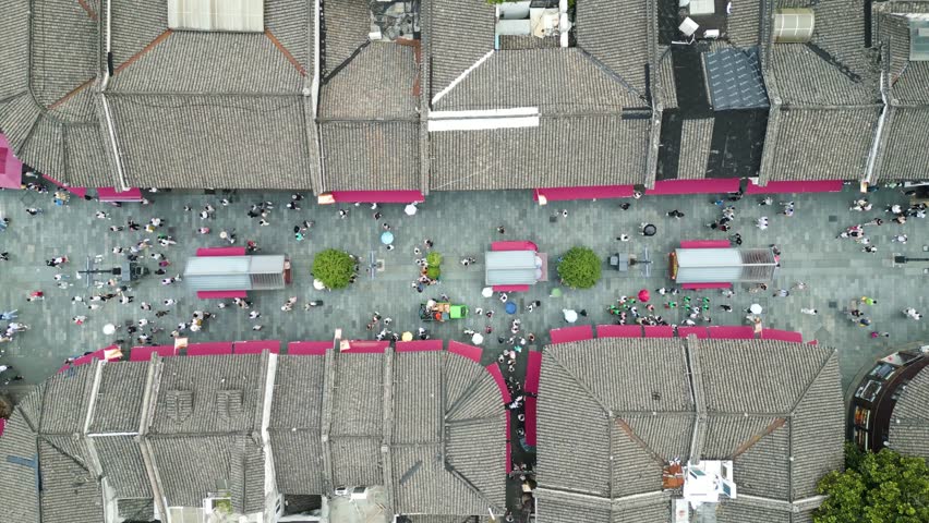 Top-down aerial shot of people walking through the historical Qinghefang street
