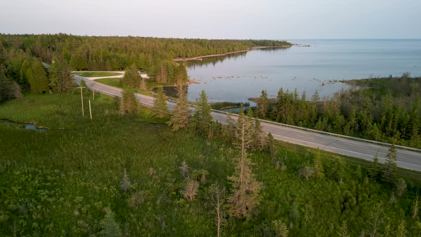 Aerial view across road of Bush Bay scenic hiking trail on Lake Huron, Michigan