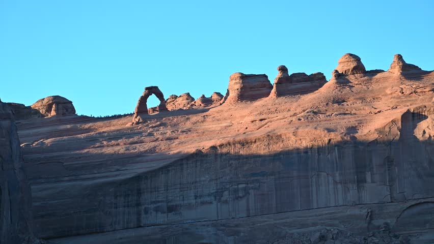 sunset in front of delicate Arch in Arches National Park