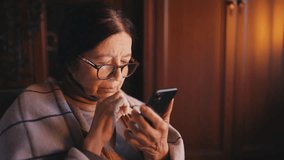 Elderly woman using smartphone, paying bills online through mobile application - Powered by Shutterstock - Get 15% off with code: PIKWIZARD15