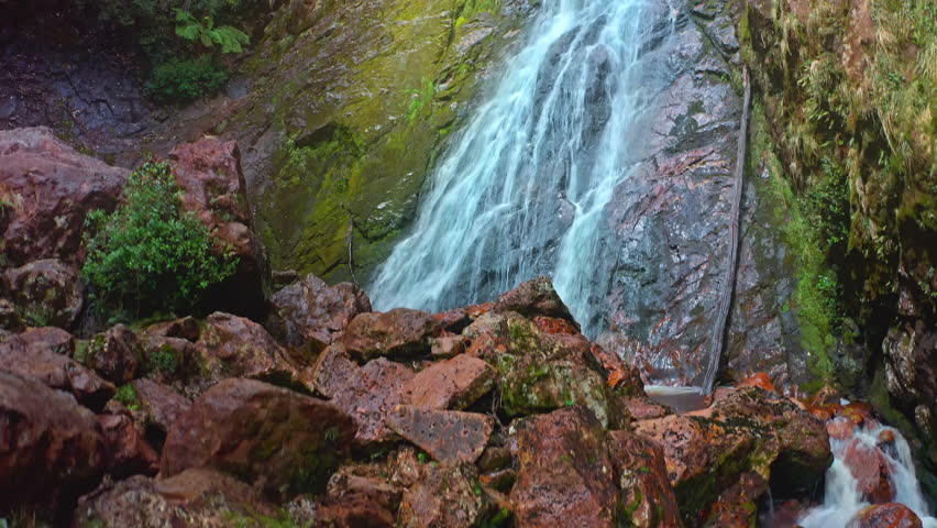 Montezuma falls in Tasmania Australia. Cascade of water flow over mountain cliff Royalty-Free Stock Footage #1109081051