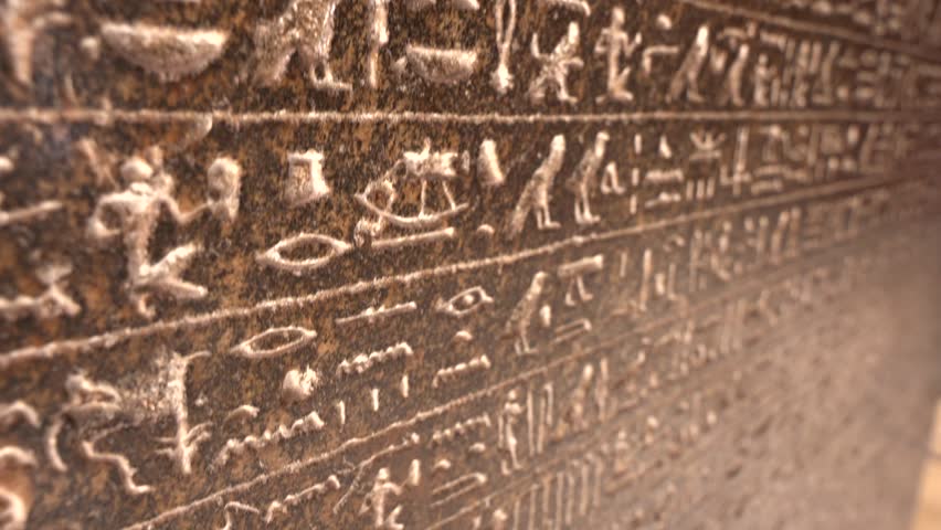 Close up of egyptian hieroglyphs on the stone in The Museum in Cairo. Heritage of ancient civilization in archaeological excavation