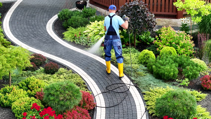 Man Pressure Washing Garden Bricks Made Path Using Modern Pressure Washer Royalty-Free Stock Footage #1109085785
