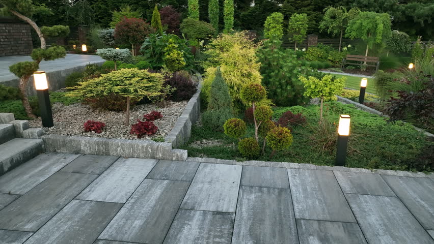 Back Yard Garden Illuminated by Modern LED Lighting System. Outdoor Lights.