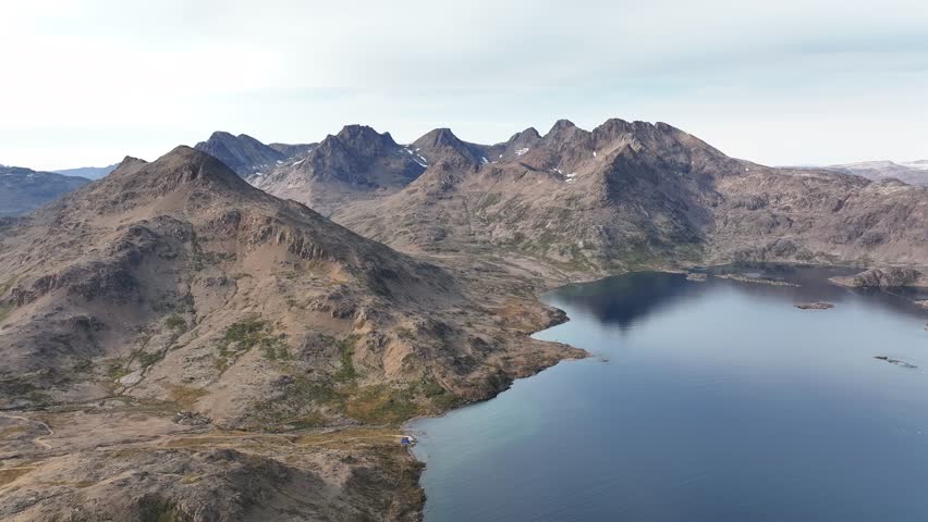 aerial view of mountain and sea in greenland
