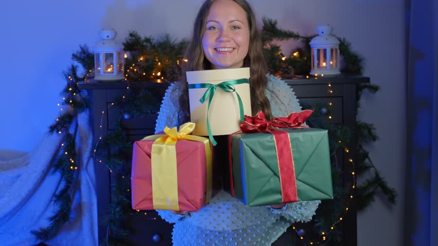 Generous brunette giving three big wrapped Christmas gift, portrait view Royalty-Free Stock Footage #1109088217