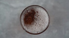Pouring Carbonated Peach Ice Tea Into Glass Top View - Powered by Shutterstock - Get 15% off with code: PIKWIZARD15